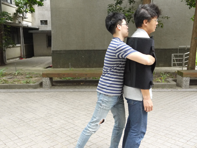 After wrapping around the target’s elbow joint, remove hands from the protective hand pockets